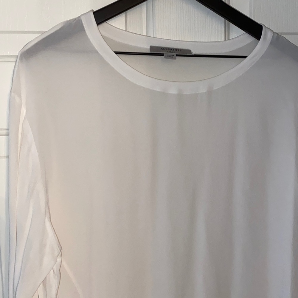 Terribly versatile top.  Can be worn with jeans +